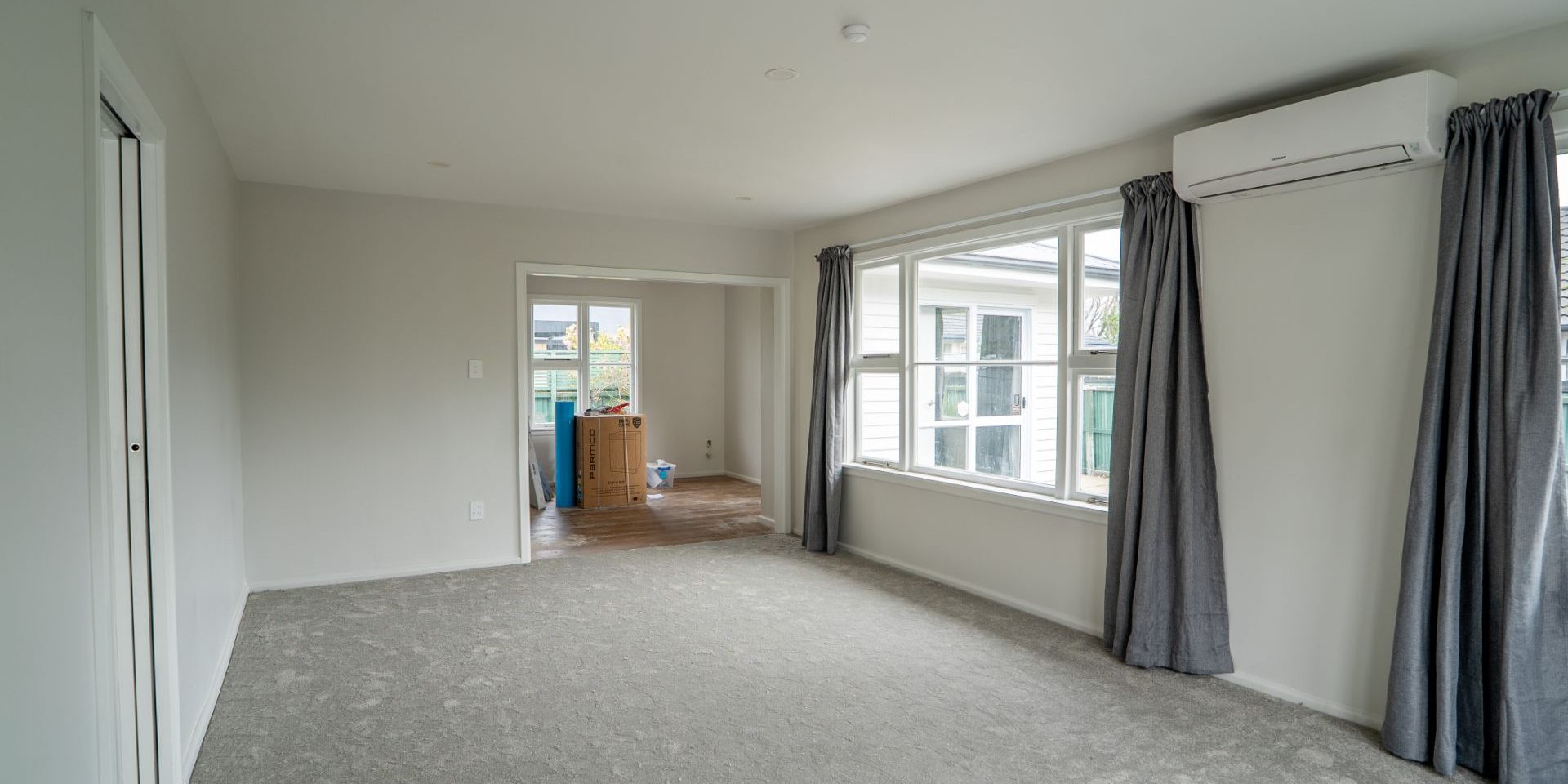 Renovated lounge with new carpet in a Christchurch home Renovated lounge with new carpet in a Christchurch home