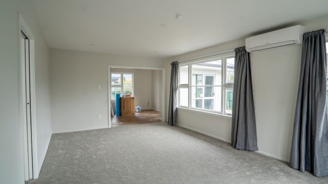 Renovated lounge with new carpet in a Christchurch home